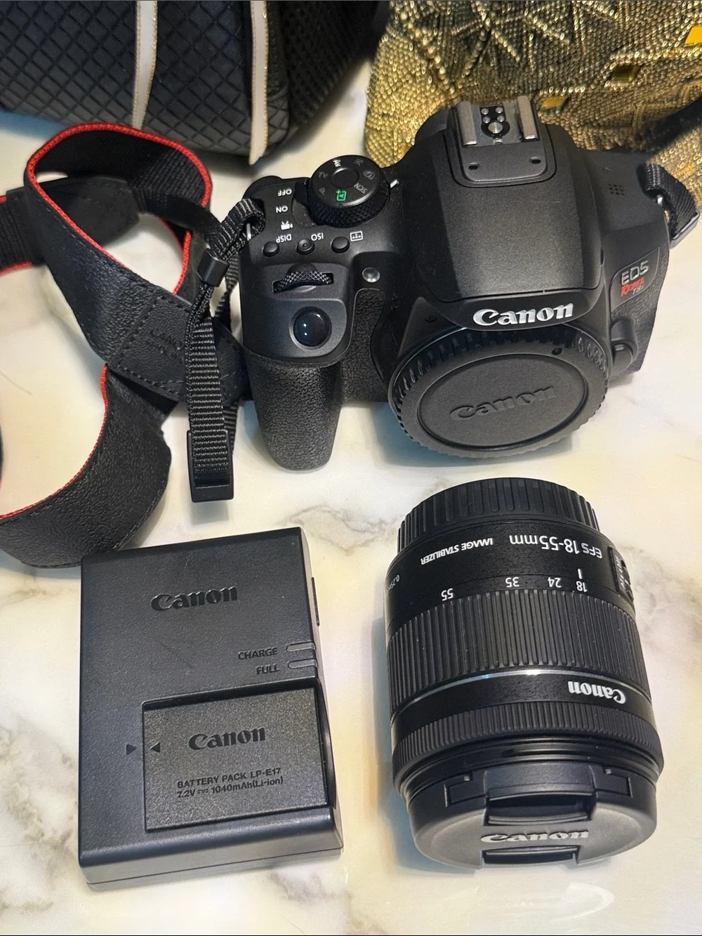 Canon EOS Rebel T8i Camera Kit in Black with Red-Trim Strap
